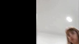 I, Angel Young, masturbates with my pink vibrator and squirts all over the bed.