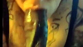 A plump BBW eagerly sucks a massive black cock in the bedroom.