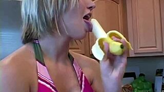 Sweet babe intensely licking banana during photoshoot