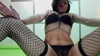 Sexy dancer rips clothes, shows pussy in stockings.