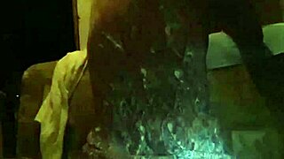 Young gay man in lingerie enjoys solo play with a dildo in a casual setting.