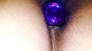 A couple explores anal play with a purple plug in the sister's big ass during homemade fun.