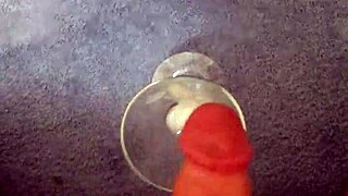 i'm masturbating alone and shooting my cum right into this glass, feeling every sensation