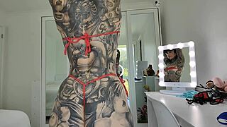 melody radford tries on red and blue micro bikini