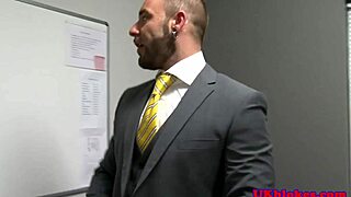 muscular british guy at office gets facial from bodybuilder.