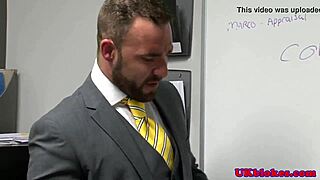 muscular british guy at office gets facial from bodybuilder.