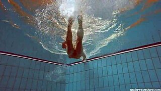 Deniska's Big Tits Bounce Sensually in Pool Swim.