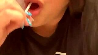 Marcy Diamond is enjoying a lollipop with lots of spit in a fun, messy way