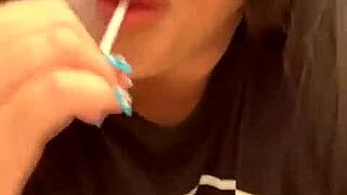 Marcy Diamond is enjoying a lollipop with lots of spit in a fun, messy way