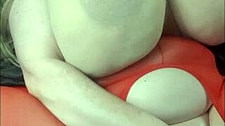 lady with huge tits playing with bbc toy on her back