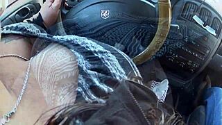 While driving, this man is showing off his wife to passersby on the road.