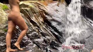 We took a naked shower in the waterfall, teasing men with our big asses