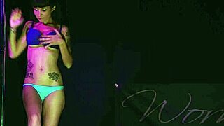 Sexy babe rips clothes while dancing striptease.