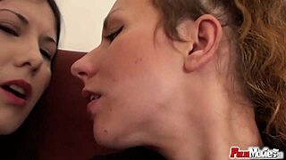 lesbians sharing a black strapon