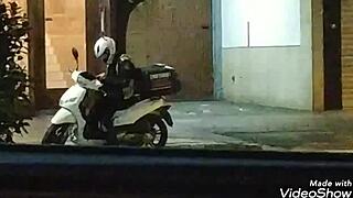 Young woman delivers intense handjob to man on crowded public street