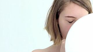 Hey there, watch this young looner babe blow and pop her first balloon!