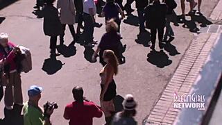 Bourbon Street afternoon flashing with wild public antics.