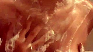 enjoying soapy shower fun with sucia