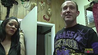 dark haired milf strips and rides dick on couch in doggystyle