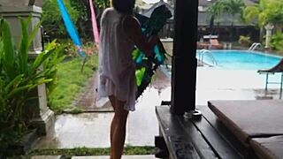 Wet dress flashing in hotel bungalow yard close up