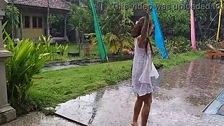 Wet dress flashing in hotel bungalow yard close up