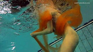 Nastya strips naked in the pool, showing her hot body underwater!