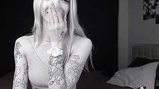 Pale slim tattoo camgirl flashes her tits on cam