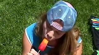 Little april is out rubbing her clit and sucking on a popsicle