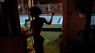 Sexy Brunette Cheerleader Undresses in Pool