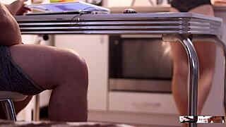 Couple shares quick intimate moment before dinner at home