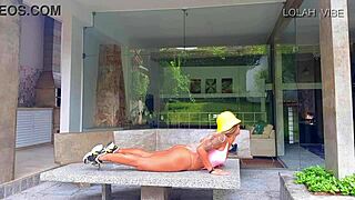 Sexy latina teacher leads stretching class in gym