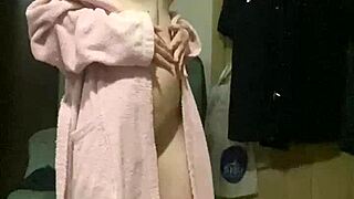 In this homemade scene, a young teen with tiny tits dances seductively for the camera
