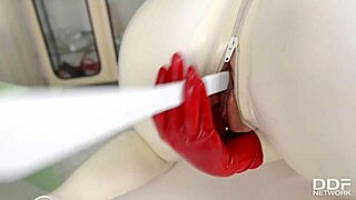 Busty latex Lucy spanks and toys her pussy