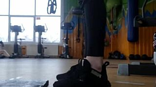 A young woman dancing in the gym and showing her ass.
