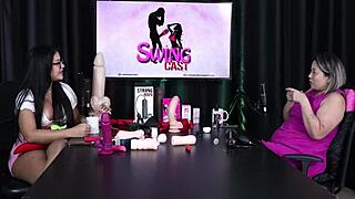 Luciana Kai demonstrates a toy for erections in sheer red lingerie.