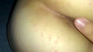 Married couple engages in anal sex at home.