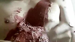 Exploring sensual wax play on a cock during intimate foreplay session