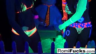 Romi Rain and Dani Daniels share lesbian sex with big tits and asses under black light