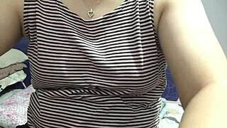 My Filipina girlfriend strips and shows natural tits when alone at home.