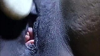 Cyndy Blackslave showing off her shaved pussy in closeup play. Ebony hairless clit teased in bdsm session.