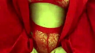 brunette in red lingerie indulges in solo play