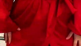 brunette in red lingerie indulges in solo play