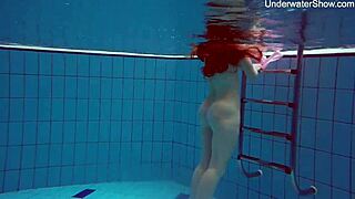 Simonna gets hot and horny underwater in the public pool