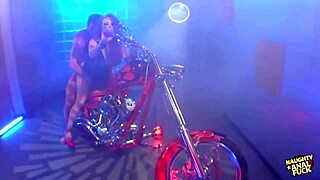 busty redheaded biker girl rides cowgirl on her bike