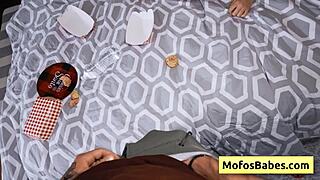 Asian teen kisses busty blonde friend playfully.