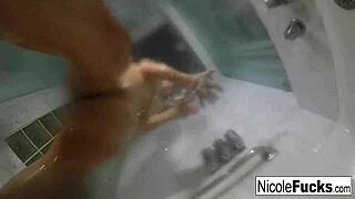 nicole aniston enjoys a hot shower, masturbating her pussy and tits