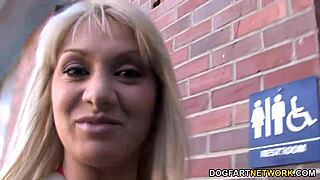 Lea Lexis sucks a big black cock at the gloryhole.