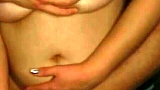 Seducing girlfriend with big breasts caressing in front of camera