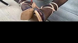 Kenia teases in black stockings and red satin dress