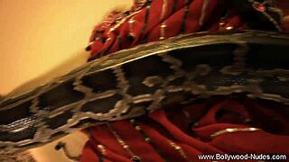 Seductive Indian MILF seduces man with dancing and striptease.